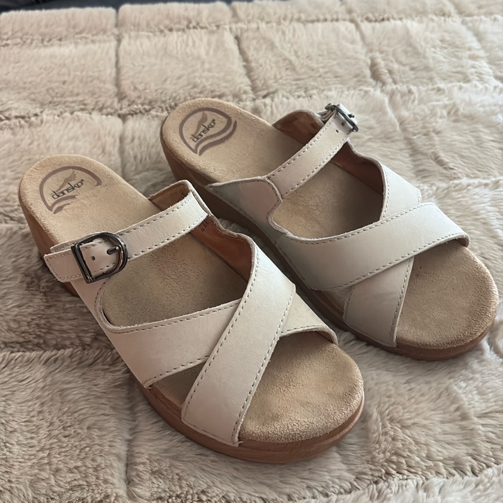 Dansko off white leather sandals adjustable buckle closure.  Size 38.